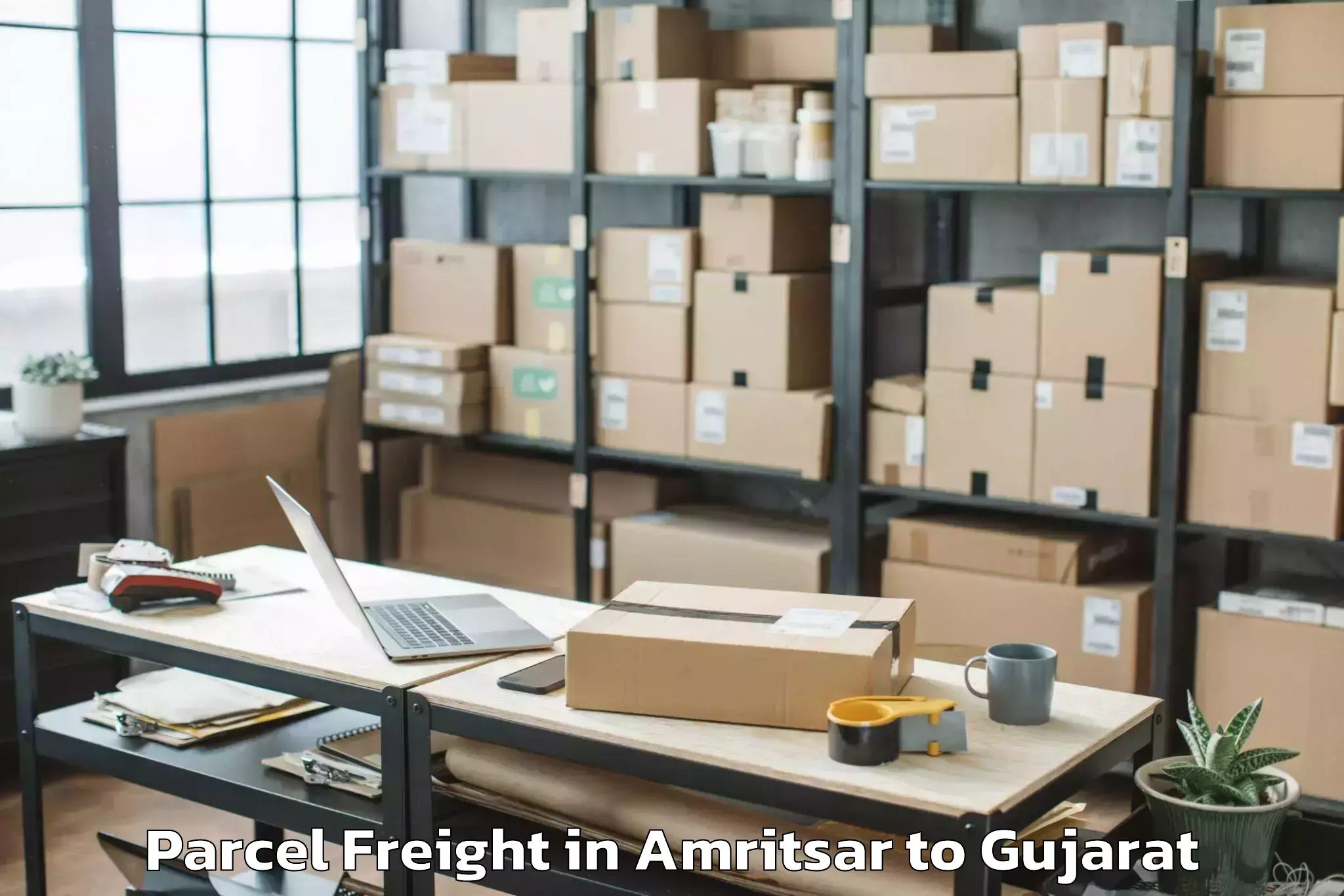 Top Amritsar to Gujarat Ayurved University Jam Parcel Freight Available